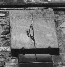 Figure 12: Dial on the southerly wall of the church of St. Nicholas.  Nearly worn away is a date of 1738