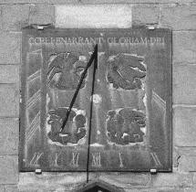 Figure 13: The fine bronze and gilt dial facing the courtyard of the Cathedral.  Decorated with the emblems of the Evangelists, it was errected in 1897