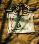 Figure 14: Stone dial at the former Trinity Hospital almshouses in the Newarke.  The supporting wall does not face true south, so the gnomon (which must be in the N-S plane) appears displaced to one side